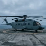 Twin-engine offshore helicopter with cabin sliding door visible, representing FAA AD on Airbus Helicopters AS332 cabin door jettison system modification`